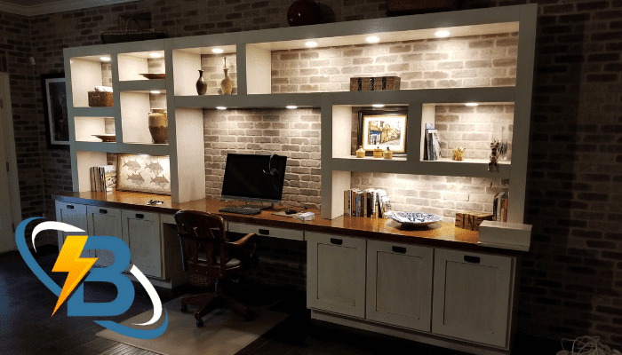 Custom home office built-in with recessed lighting and desk, branded by 1 Best Electric in Cartersville, GA.