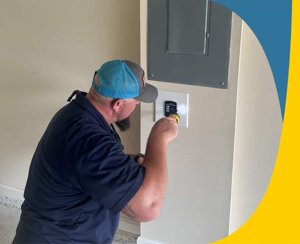 electrician-working-on-switch-near-panel